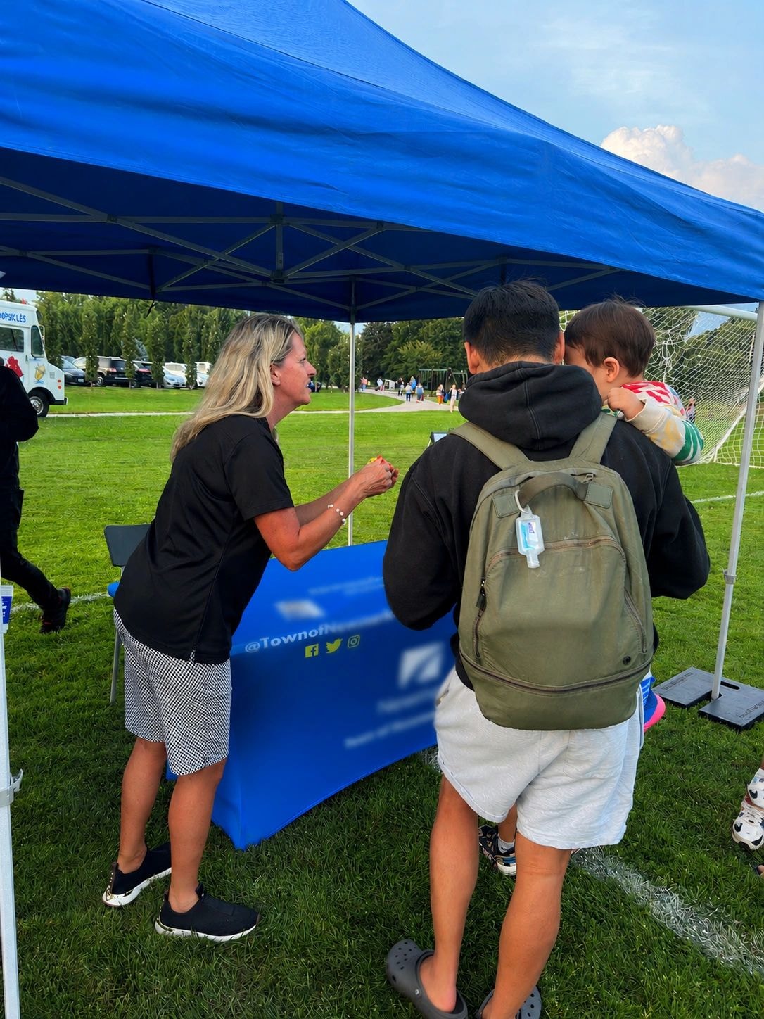 Jane Twinney at community event outdoor booth
